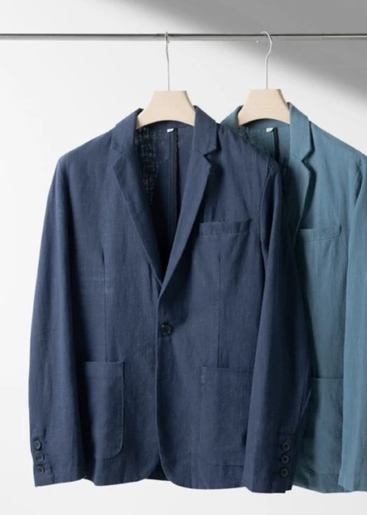 Navy wool blazer on a hanger